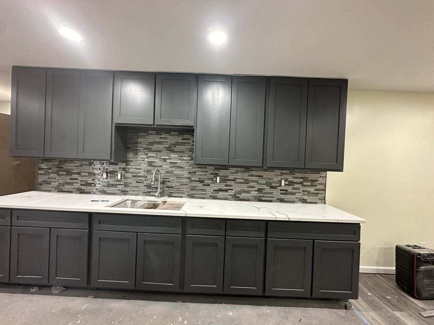 Homeowners and crew working together on a painting project