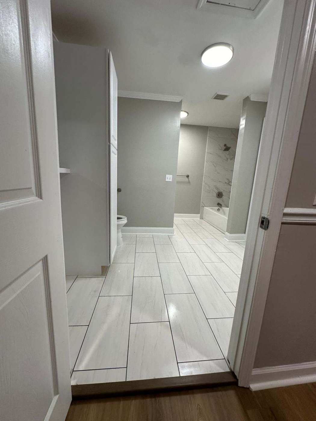 Freshly painted room with newly refinished hardwood flooring